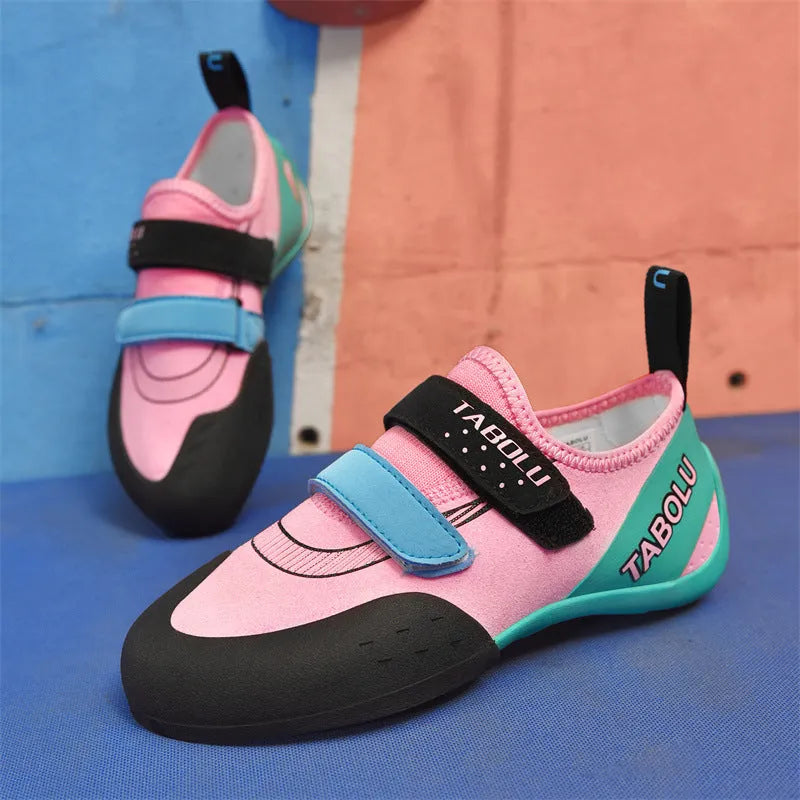 Black and red beginner rock climbing shoes with Velcro closure and rubber outsole