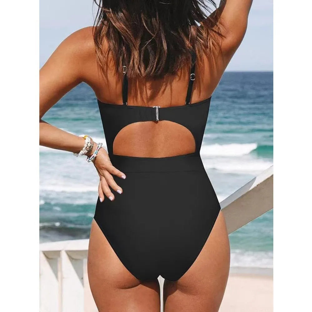 Women's solid colour cross backless one-piece swimsuit on a mannequin