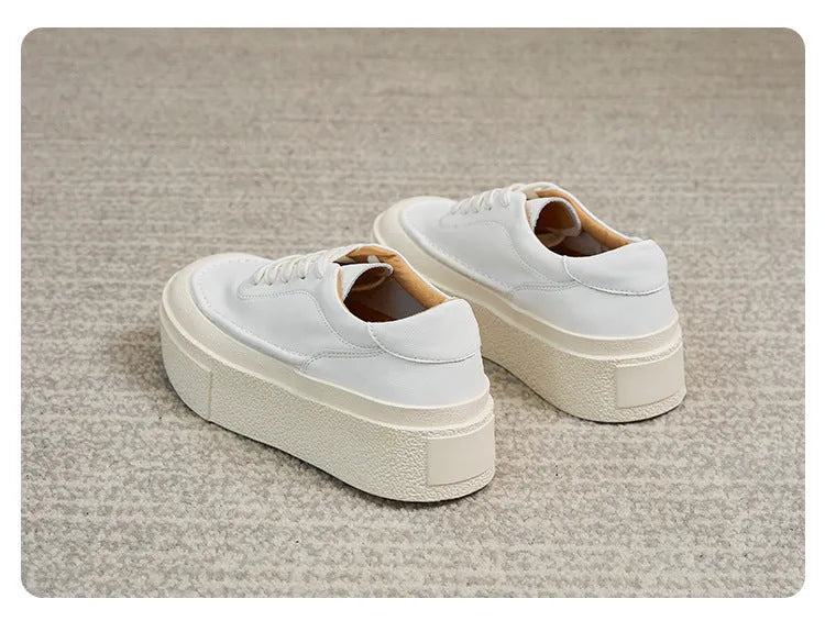 Women's black platform sports shoes with embossed cowhide upper and rubber sole