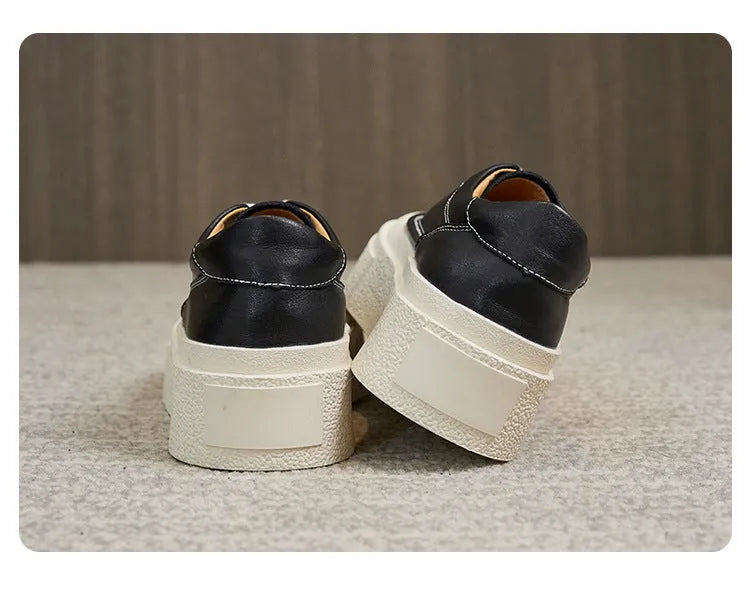 Women's black platform sports shoes with embossed cowhide upper and rubber sole