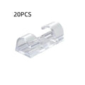 Transparent self-adhesive plastic cable clips in small, medium, large, and extra large sizes for wire management.