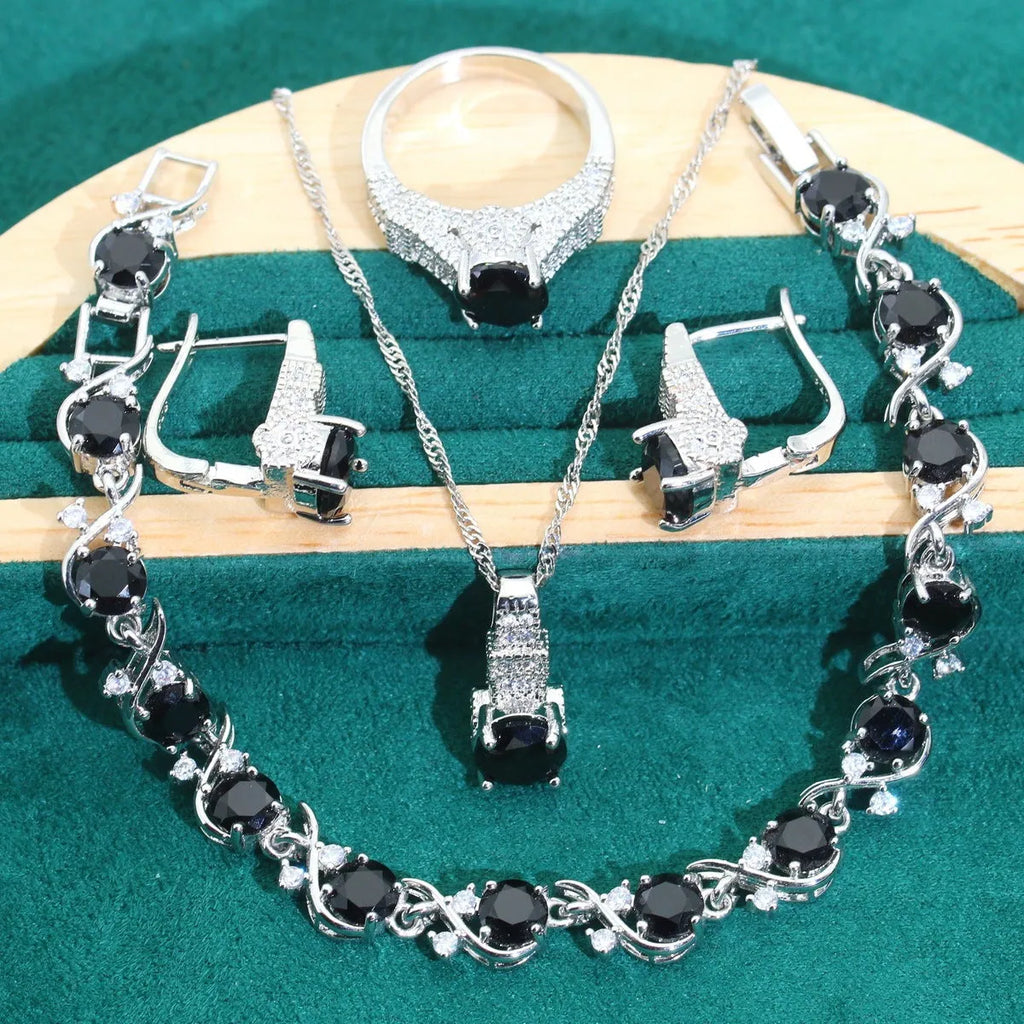 Bridal zircon jewellery four-piece set showing necklace, bracelet, earrings and ring in alloy with water wave chain