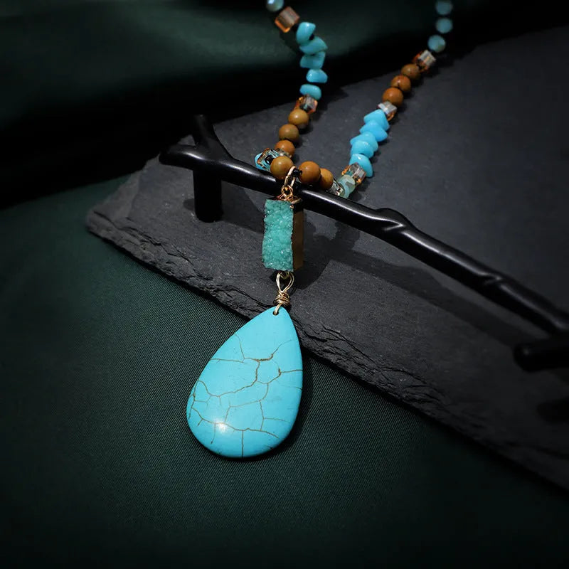 Turquoise blue water drop shaped pendant necklace with ball bead chain and geometric design elements