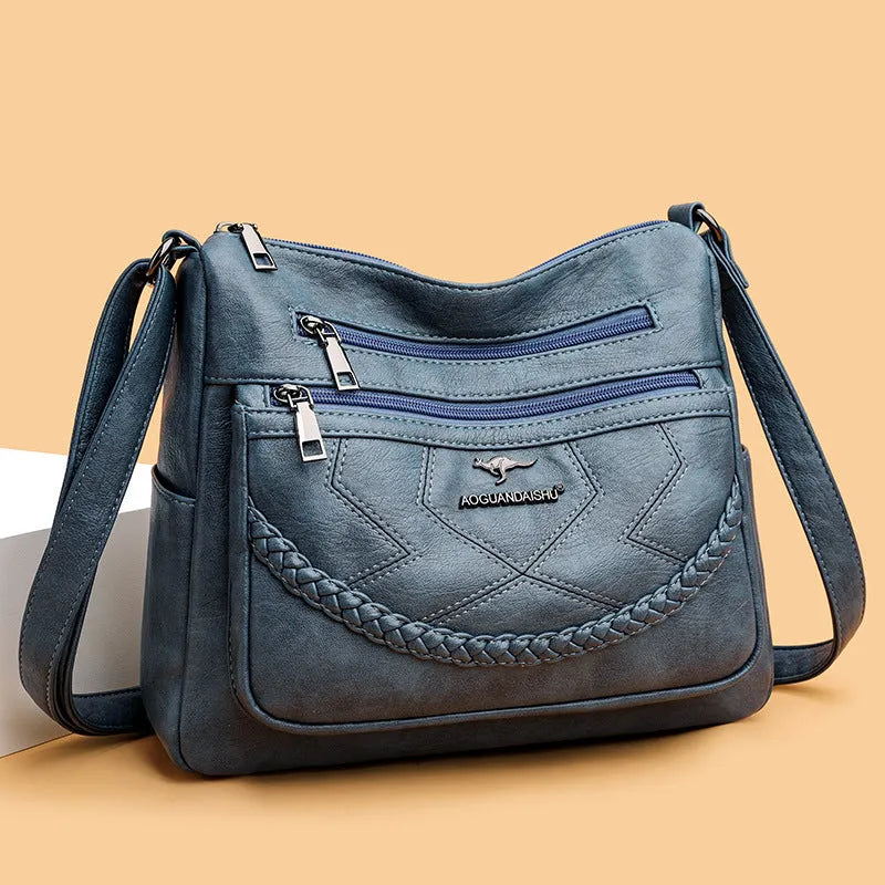 Soft PU leather women's crossbody shoulder bag in horizontal square shape with internal zipper compartments