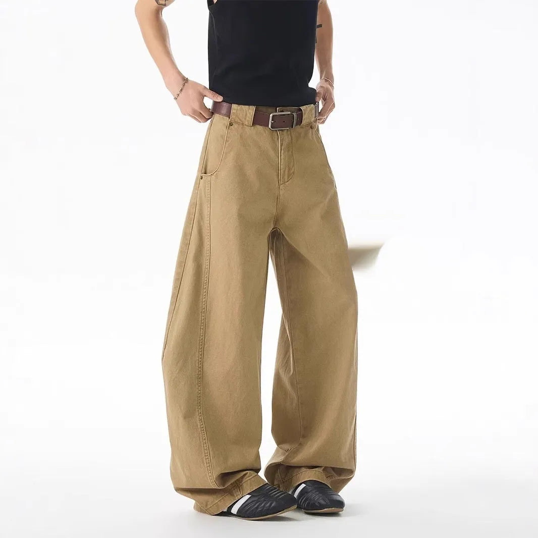 Brown loose-fit straight-leg men's jeans with a button fly and mid-rise waist.