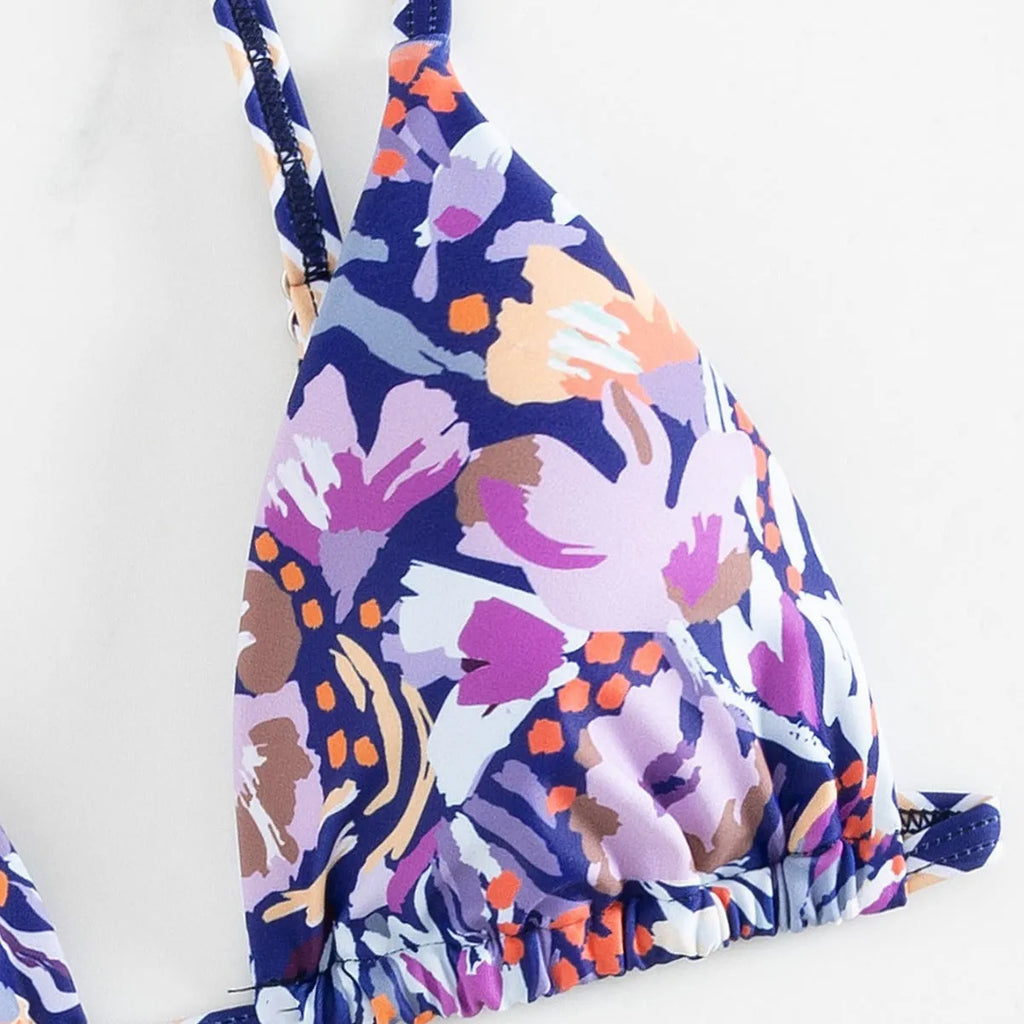 Women's floral print polyester triangle bikini swimsuit with briefs-style bottom.