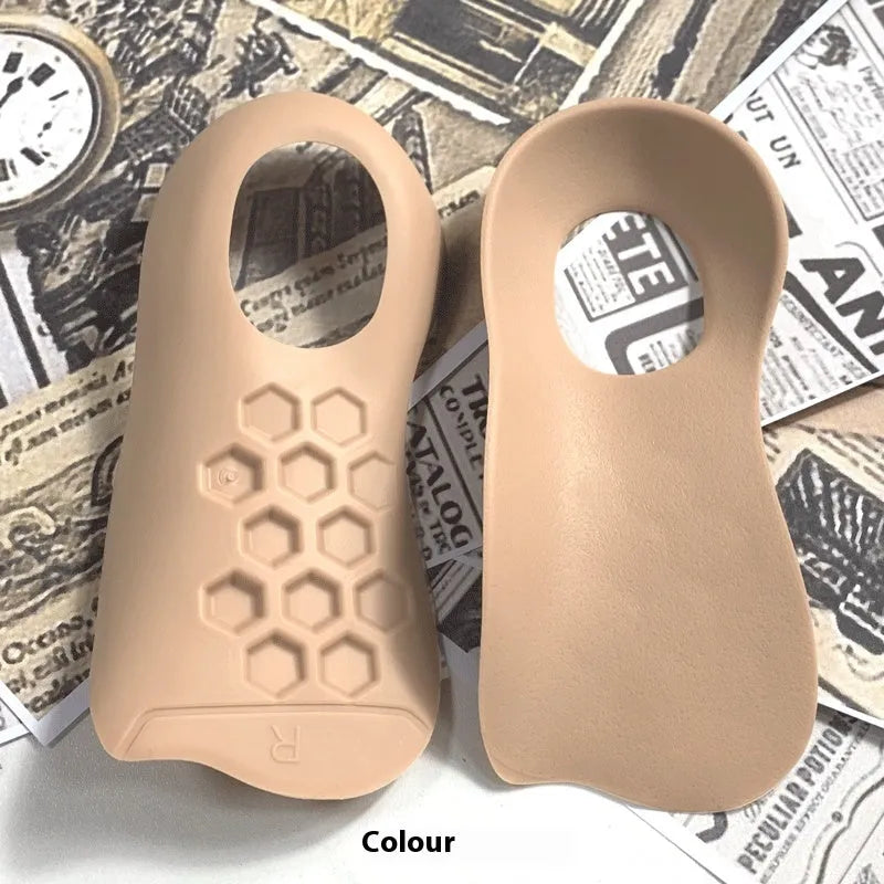 Pair of white TPR arch support insoles for varus correction, showing raised medial arch design.