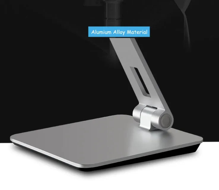 Silver folding aluminium phone and tablet stand with 360-degree rotation on desktop