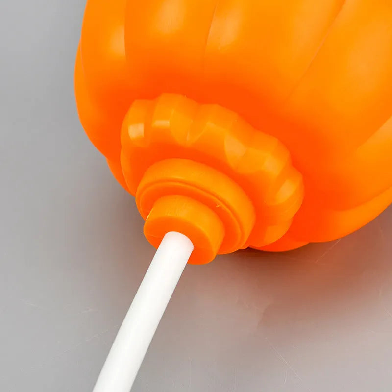 Plastic pumpkin lamp with USB charging port displaying yellow or purple light option