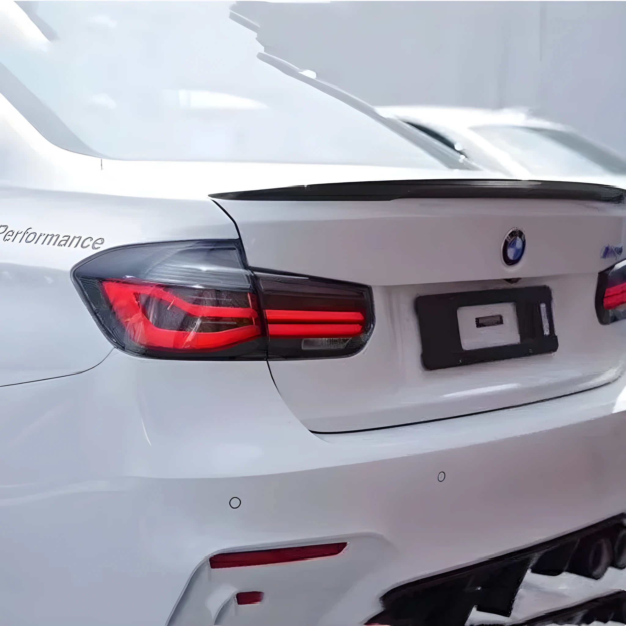 BMW 3 Series LED tail light assembly with streamer steering lights in red or smoked black finish