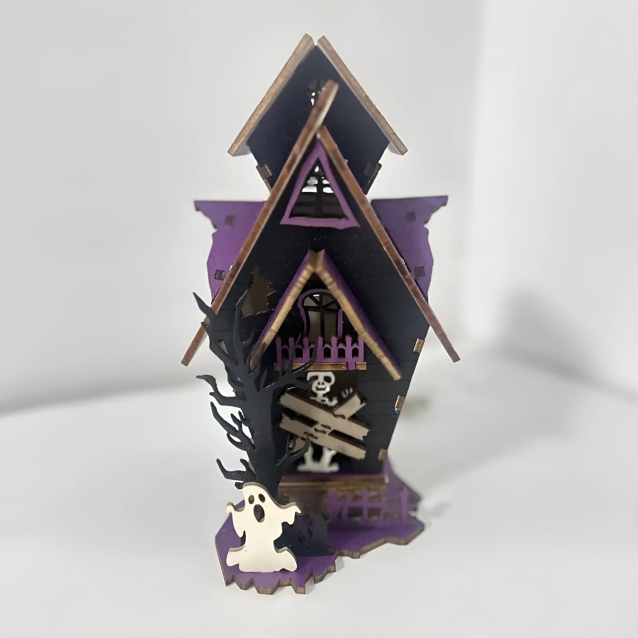 Wooden Halloween haunted house table decoration with luminous glowing design measuring 14 cm wide