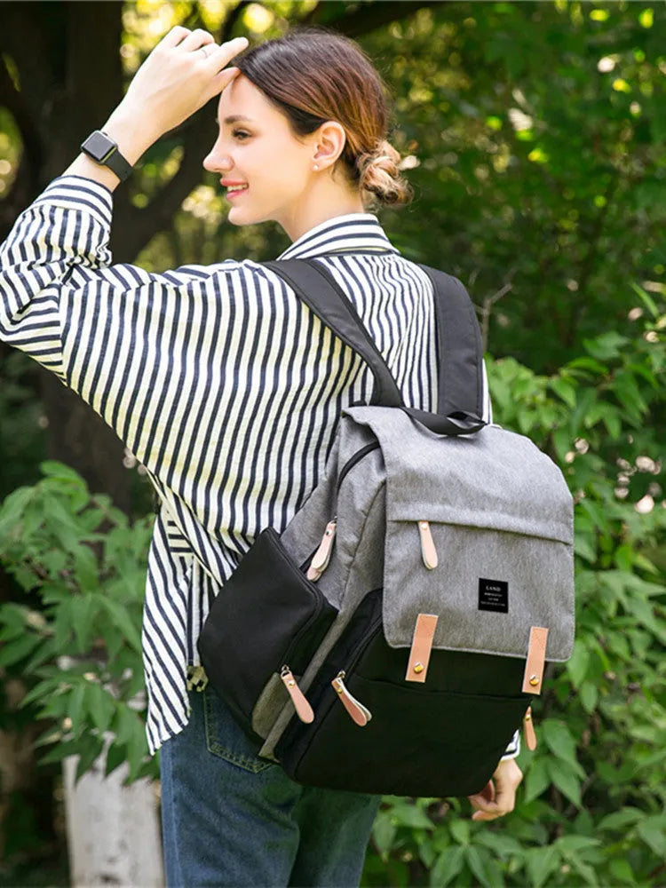 LAND Mommy large capacity oxford cloth diaper backpack with changing mat in beige colour.