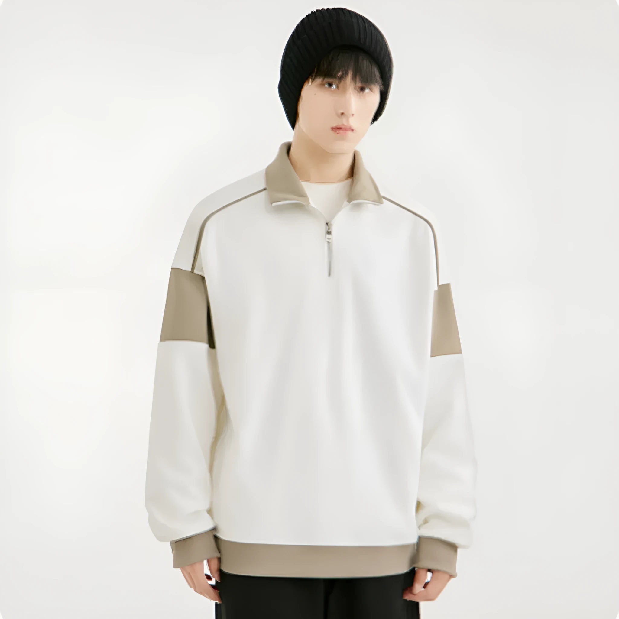 Man wearing a thin black hooded corduroy sweatshirt with drop shoulder and loose lapels.