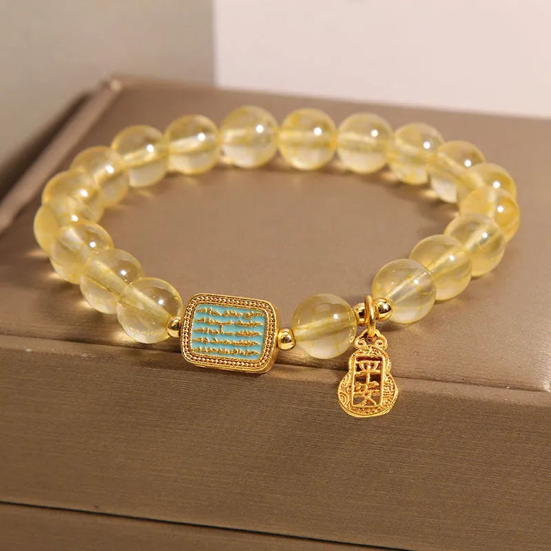 Women's natural yellow citrine crystal bracelet with decorative rhinestone elements