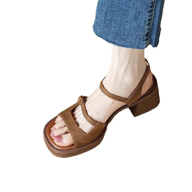 Women's open toe square toe retro platform sandals in milky white colour on a neutral background.