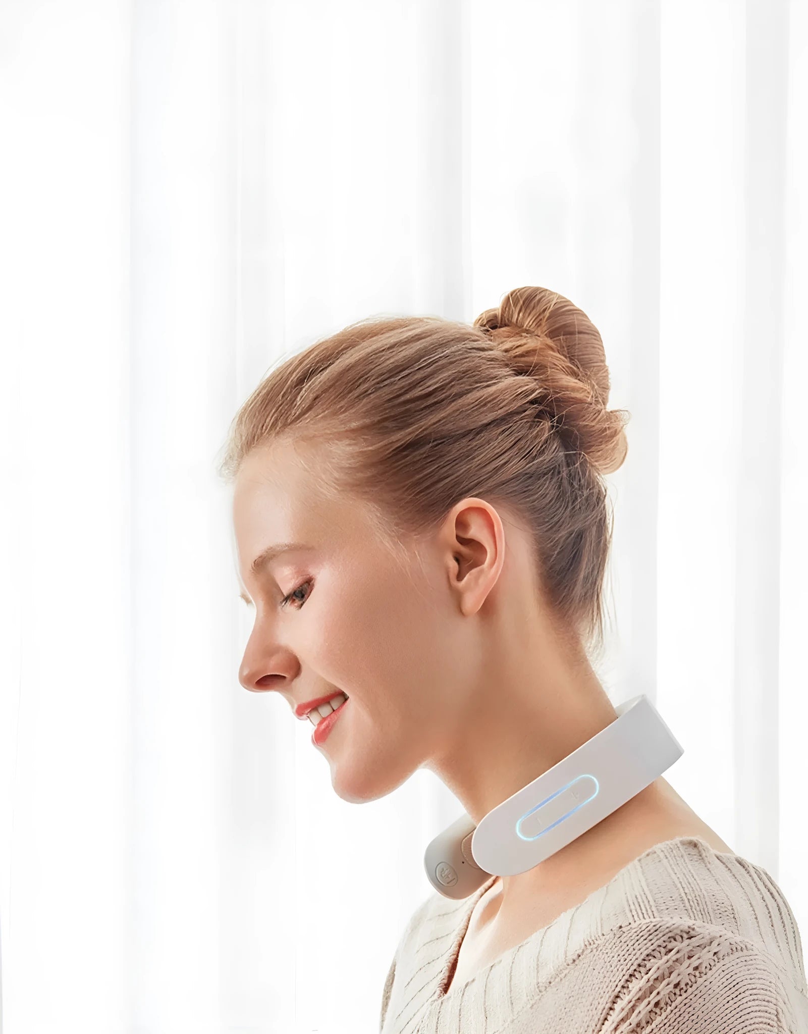 White electric acupressure massager showing control buttons and heat function for back neck shoulder pain relief