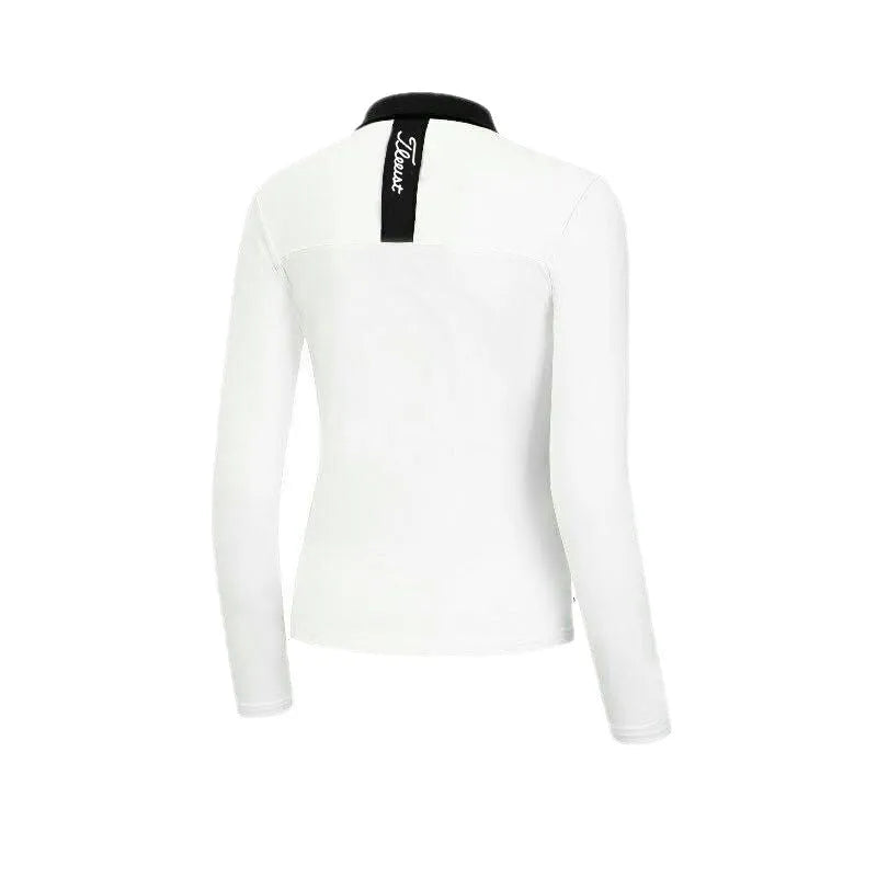 Women's black and white long sleeve golf top with slim fit design for outdoor sports