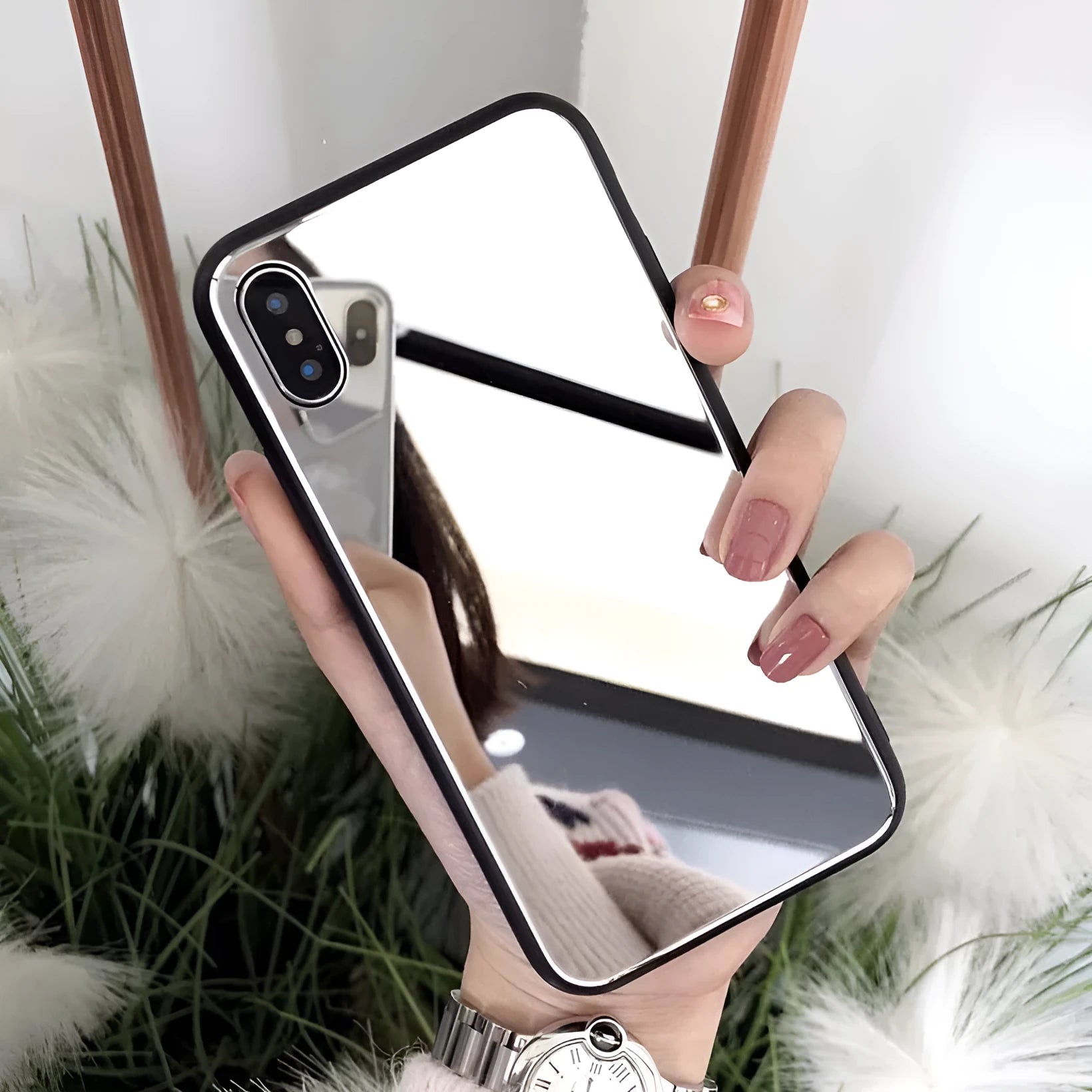 Black iPhone mirror phone case showing reflective back surface, compatible with multiple iPhone models.