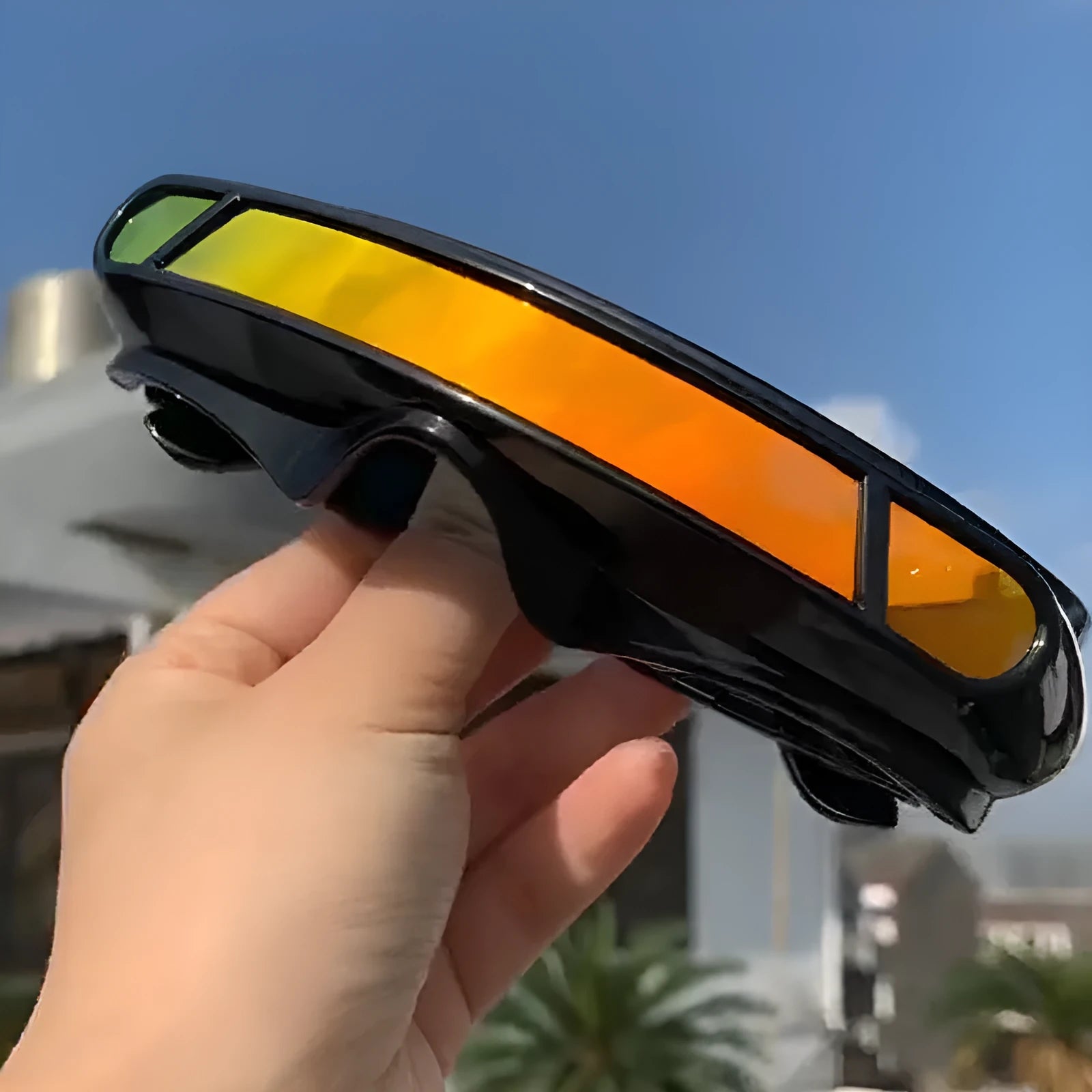Polarised sunglasses with black PC sports frame and colour film lenses.