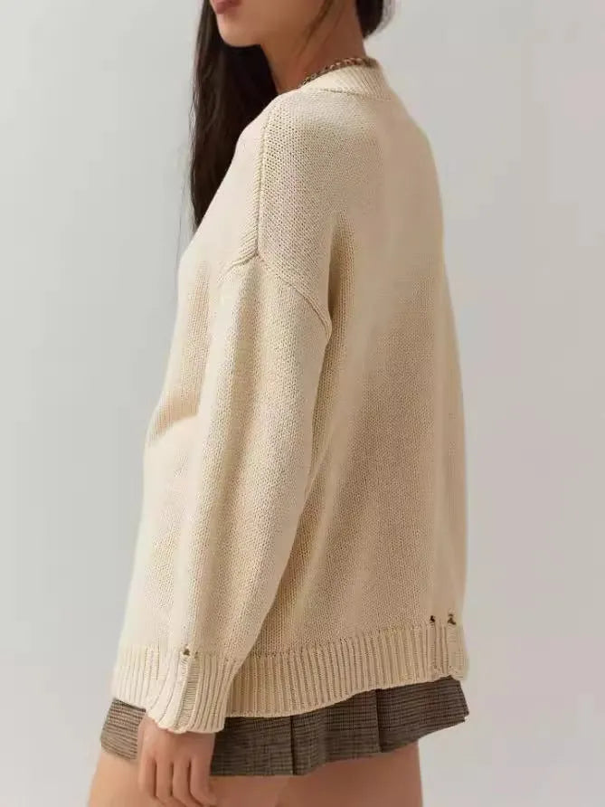 Women's beige round neck pullover sweater with jacquard pattern and long sleeves