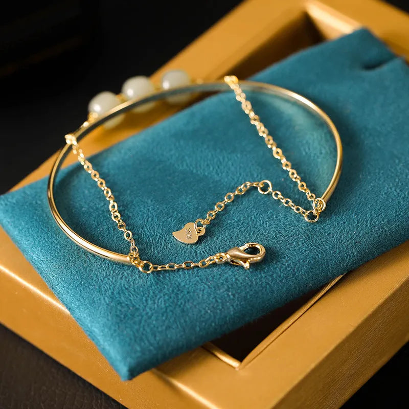 Hetian jade women's bracelet with gold inlay, showing lucky bead design in single, double, and three bead styles.