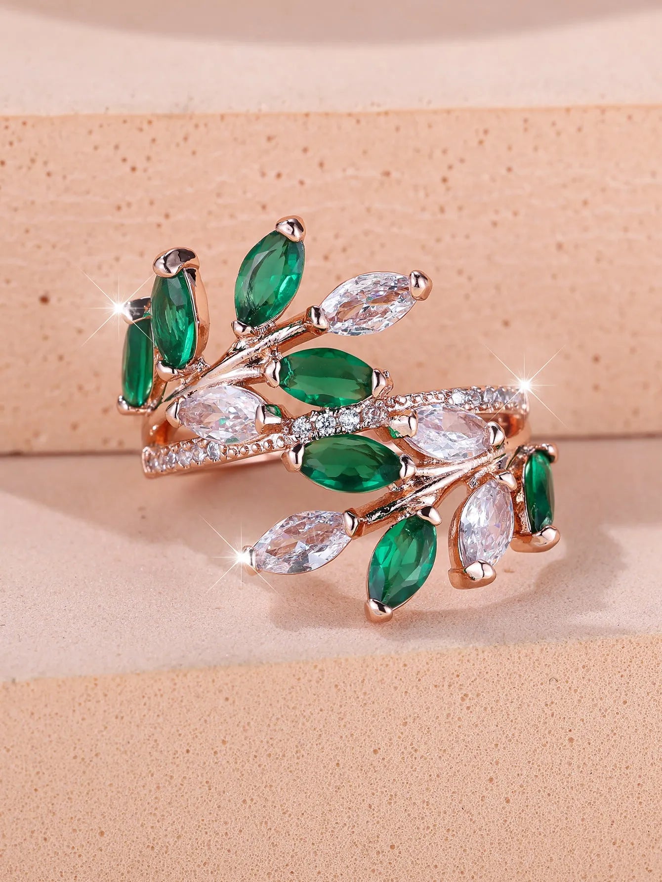 Adjustable horse eye design leaf ring in copper with zircon crystals, shown in a rose gold finish