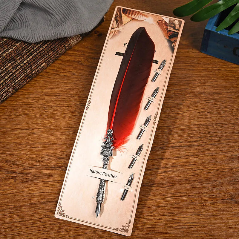 Vintage feather dip pen with zinc alloy body in ten colour options on cardboard packaging.