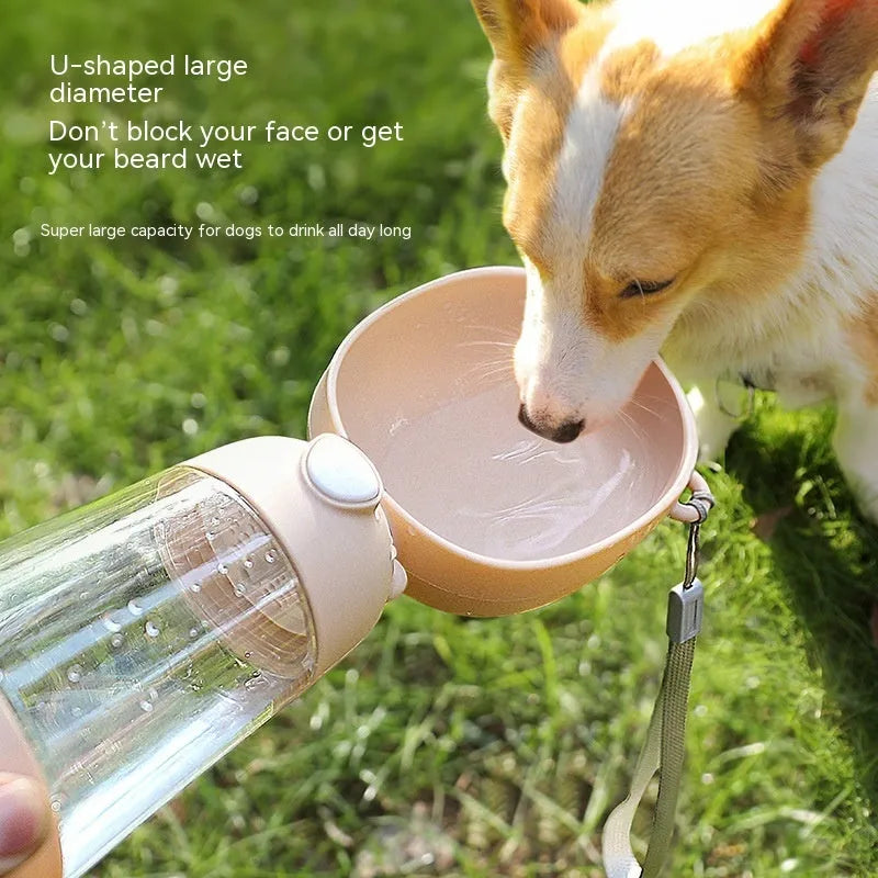 Portable dog water bottle with integrated food container for outdoor travel with pets