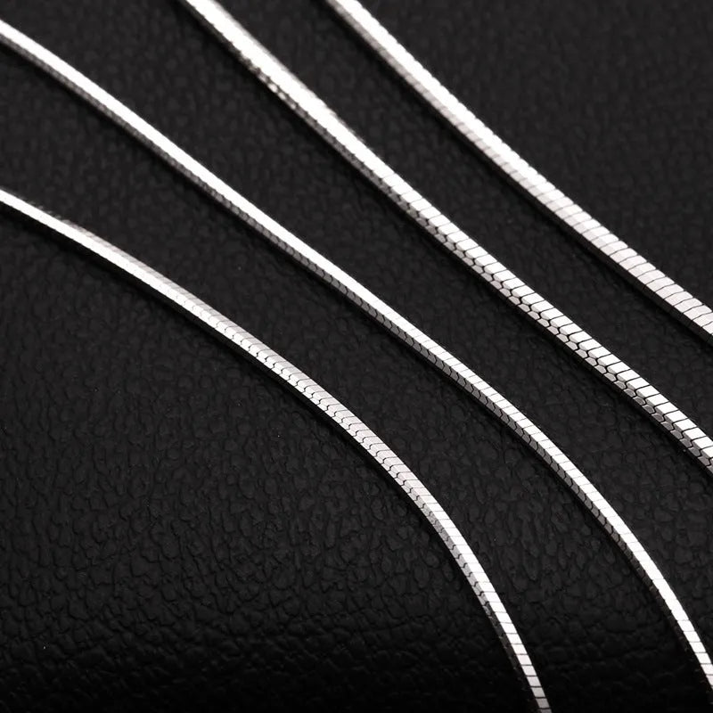 Sterling silver plated platinum necklace chain on display showing width and length options for men and women