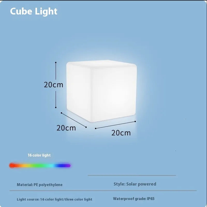 Square LED cube stool light in garden setting showing modern design with lighting