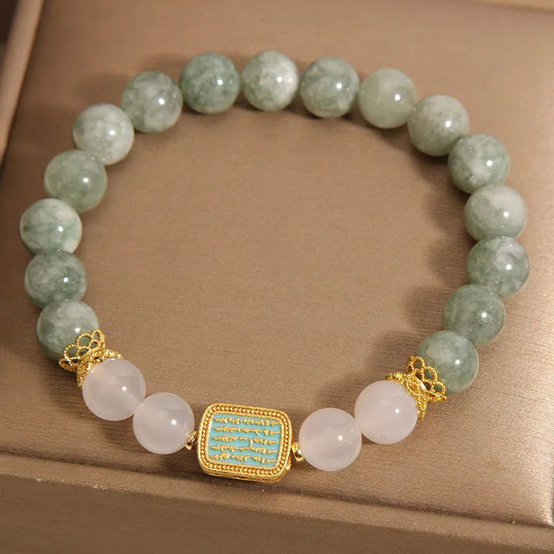 Women's oil green emerald crystal bracelet with five scriptural charms on wrist