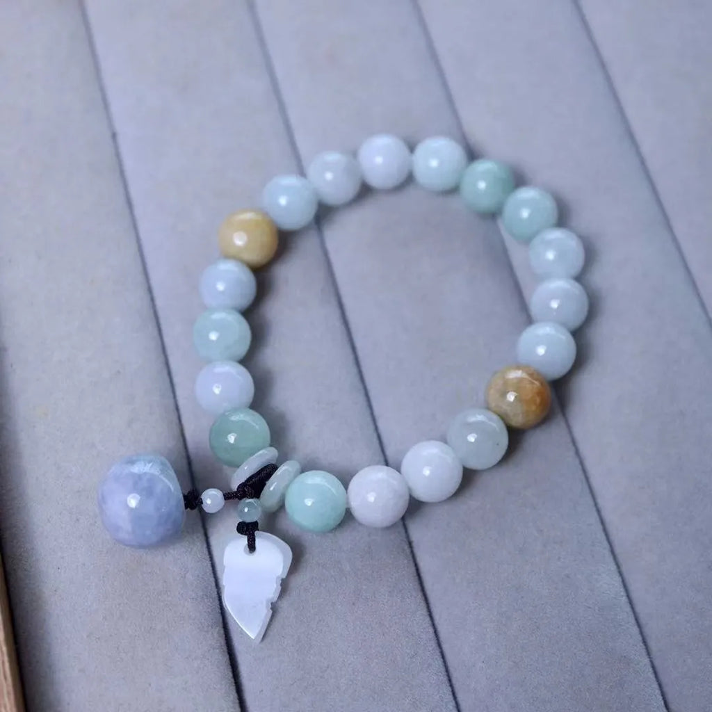 Jade hanging bracelet with Maitreya Buddha, apple, gourd, and money bag charms