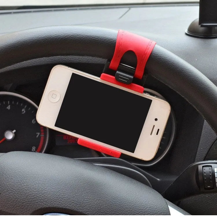 Black steering wheel phone clip holder mounted with smartphone showing navigation display