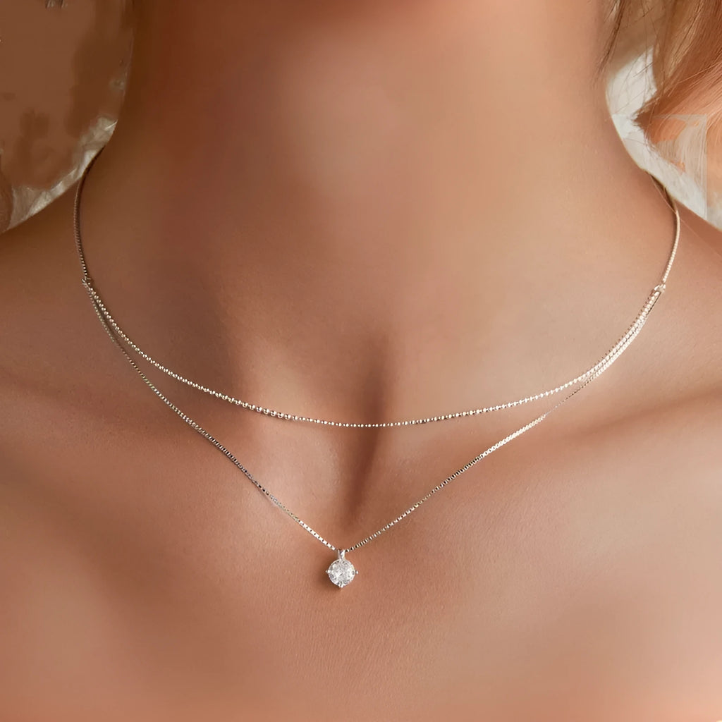 Women's double-layer sterling silver necklace with pearl chain detail in polished silver colour