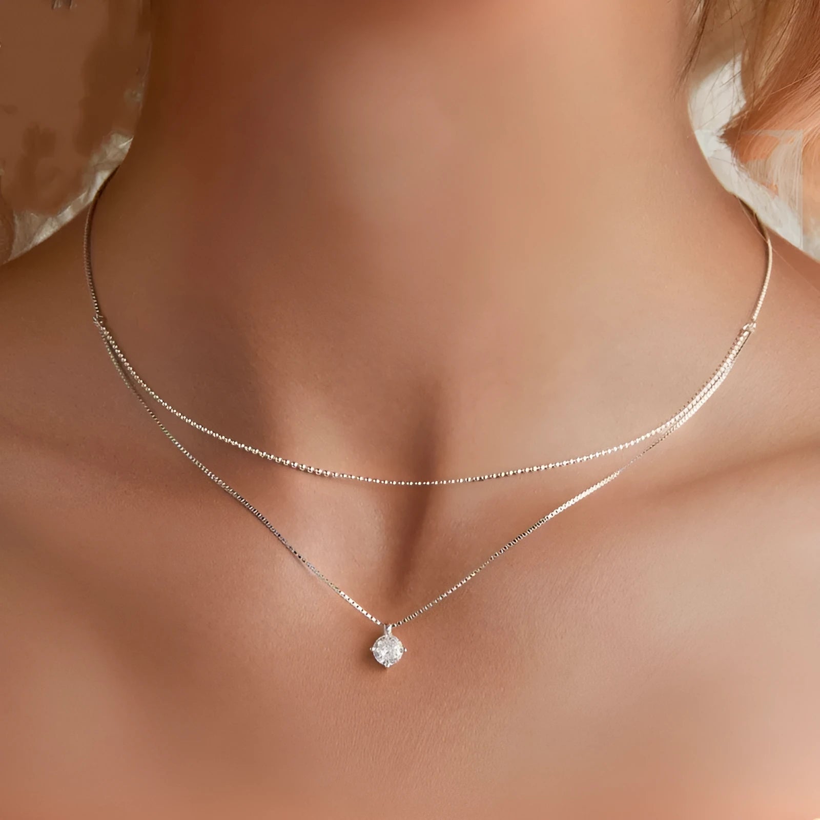 Women's double-layer sterling silver necklace with pearl chain detail in polished silver colour