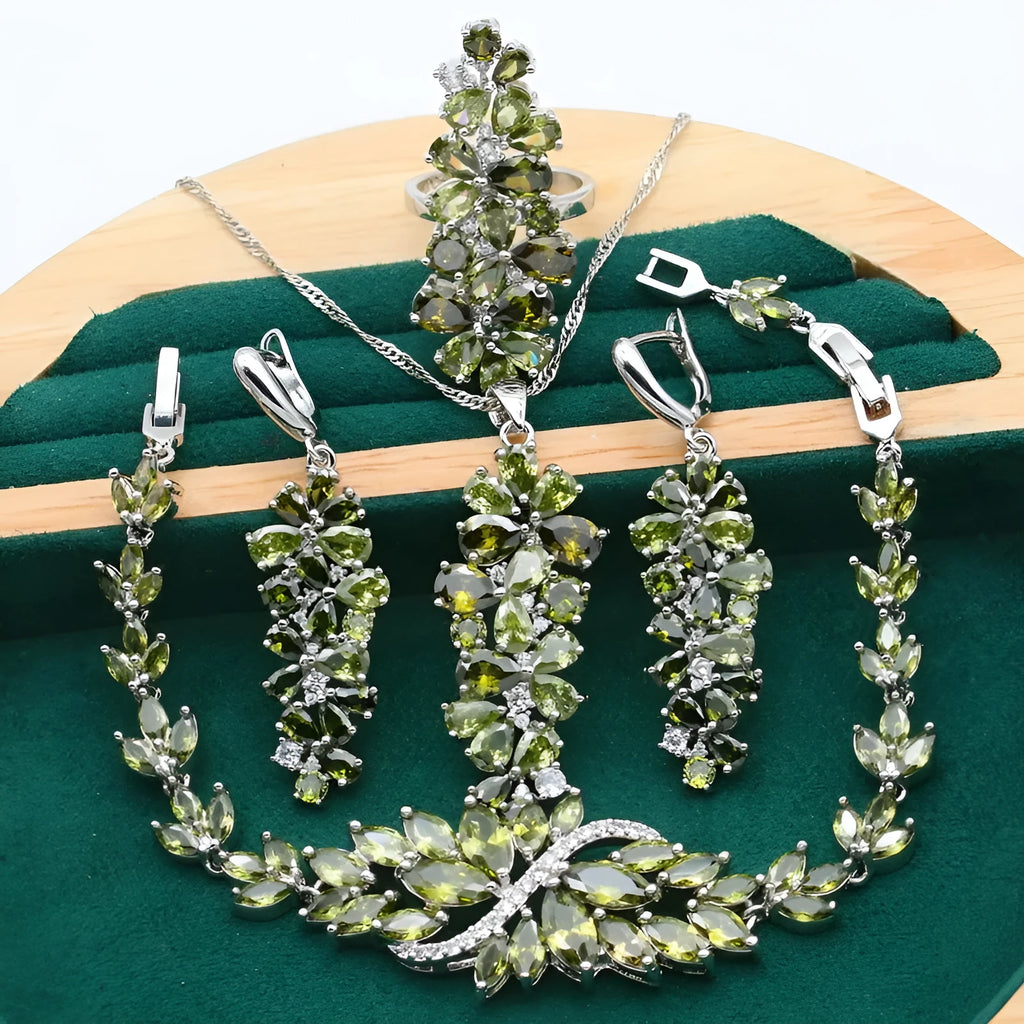 Retro jewellery set with plant pattern designs showing necklace, bracelet, earrings and ring pieces
