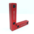 Aluminium right angle positioning block for woodworking jigsaw on a workbench.