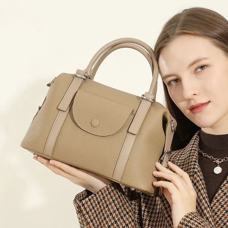 Genuine leather ladies handbag with contrast stitching and lock detail in street-trend style