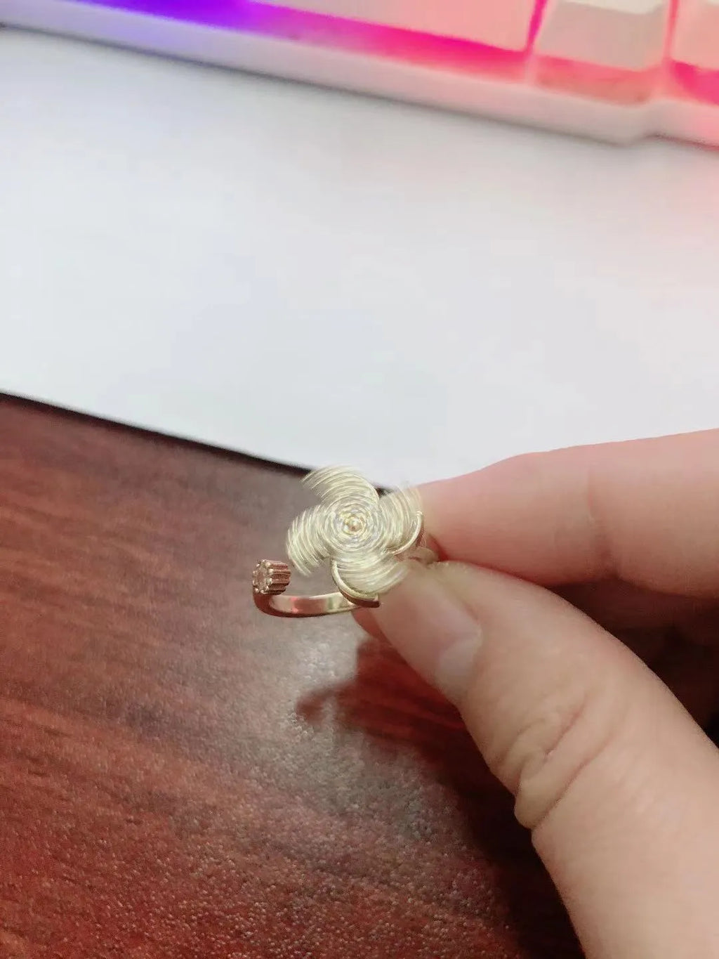 Copper rotating windmill ring with electroplated gold or silver finish and geometric circular design