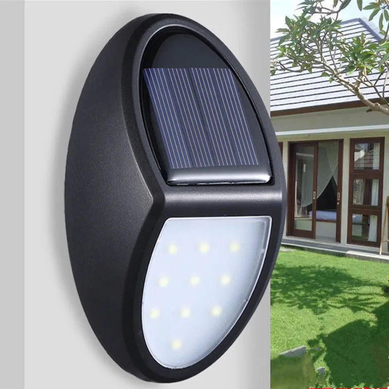 Black rectangular solar wall light with solar panel and LED illumination