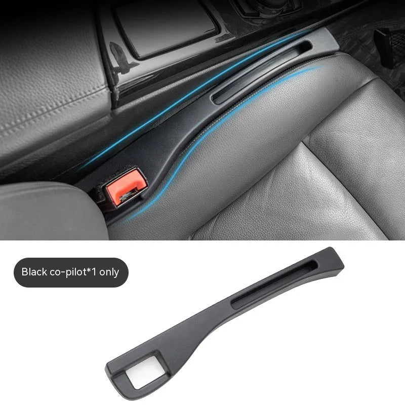 Black car gap storage box with handle placed between vehicle front seats