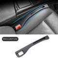 Black car gap storage box with handle placed between vehicle front seats