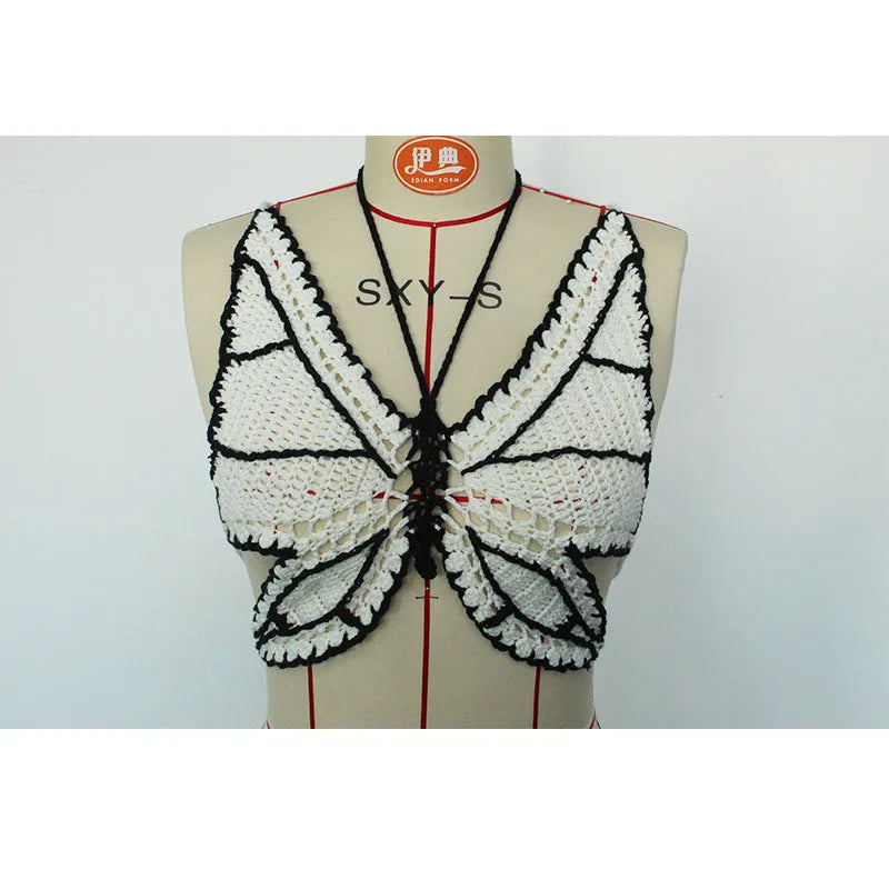 Women's classic black and white bikini swimsuit on a hanger.
