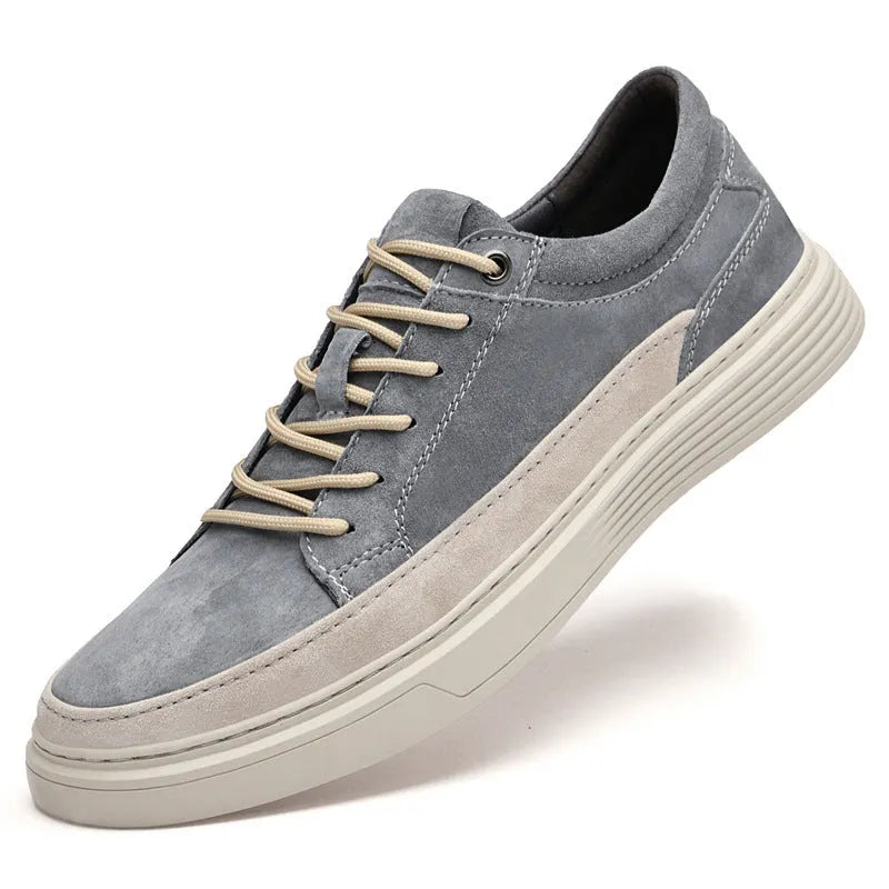 Men's grey casual skate shoes with pigskin leather upper and rubber sole, front lace-up closure