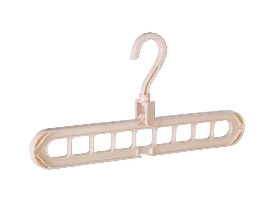 Plastic clothes hanger with rotating hook in pink and green colours on a rail.