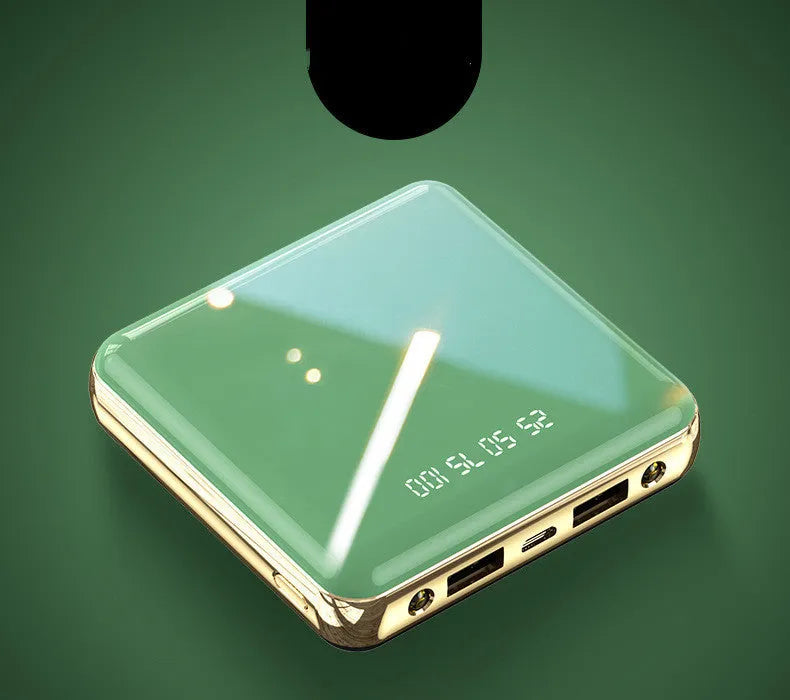 Blue cylindrical mini power bank showing multiple USB ports on a compact body.