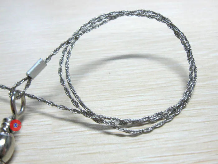 Stainless steel wire survival saw with thumb rings coiled for outdoor camping