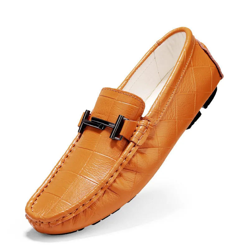 Men's black casual leather shoes with a silver belt buckle and flat rubber sole.
