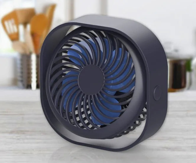 Compact USB desk fan in alarm clock style with blue colour finish, showing 360-degree rotation.