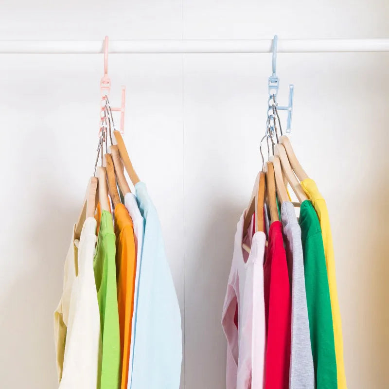Magic revolving wardrobe hanger with five holes and handle in blue, green, or pink for clothes organisation
